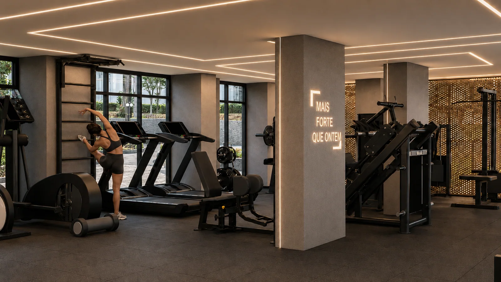 Espaço fitness projetado pela Fox Team em condomínio residencial, com iluminação embutida e painel perfurado